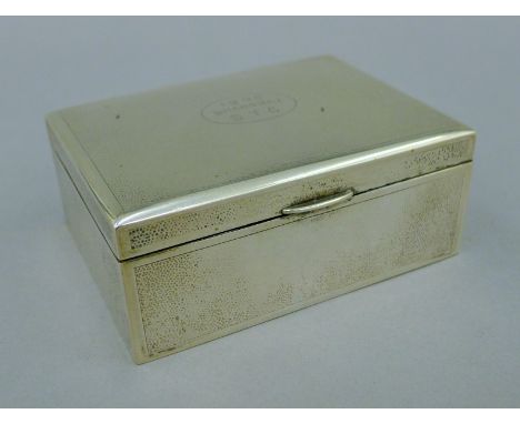 A small Chinese silver cigarette box with presentation inscription. 11.5 cm wide. 