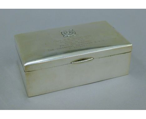 A Chinese silver cigarette box with presentation inscription. 16 cm wide. 