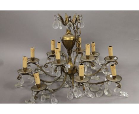 An eight branch brass and glass drop chandelier. 47 cm high. 