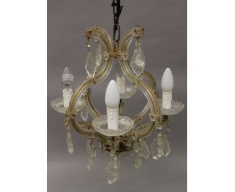 A Venetian glass chandelier. Approximately 45 cm high.