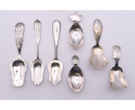 Seven Continental silver caddy spoons. The largest 12 cm long. 66.2 grammes.