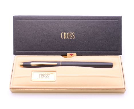 A boxed Cross roller ball pen.