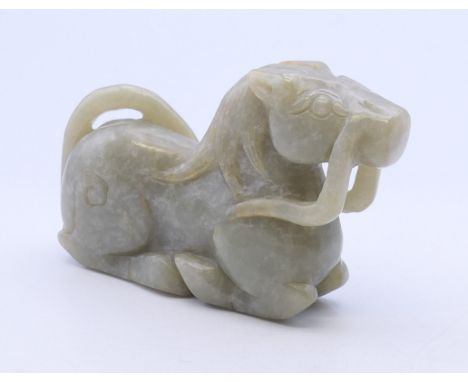 A jade carving of a recumbent horse. 8 cm long.