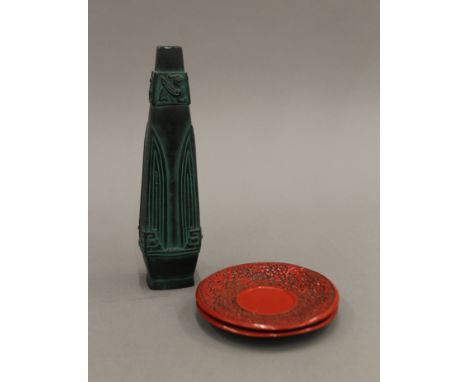 An Oriental bronzed vase and two cinnabar saucers. The former 25 cm high.