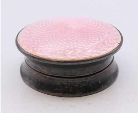 A silver and pink enamel balm pot. 3.75 cm diameter. 
