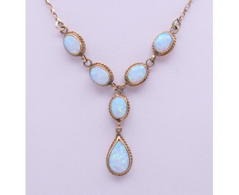A 9 ct gold opal pendant necklace. 39 cm long. 7.2 grammes total weight.
