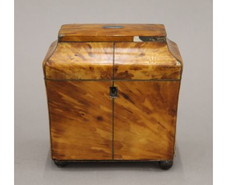 A 19th century tortoiseshell tea caddy. 14 cm wide.
