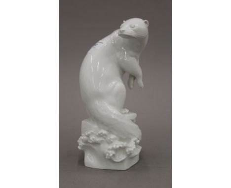 A Meissen blanc de chine model of an otter. 24.5 cm high. 