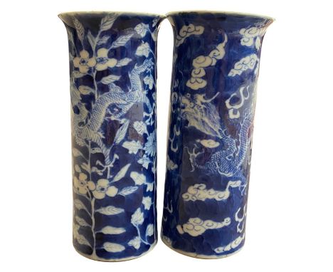 Pair of 19th century Chinese porcelain vases the blue ground decorated with dragons in Kangxi style with four character mark 