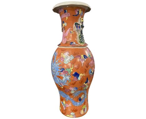 Chinese porcelain vase late 19th Century, the coral ground with polychrome decoration of a dragon chasing the flaming pearl w