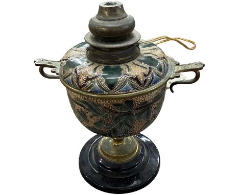 Doulton Lambeth oil lamp on black circular slag base with incised designs in green on buff ground, 27cm high