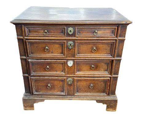 17th Century and later oak chest of drawers with four graduated drawers with moulded decoration and brass ringlet handles set