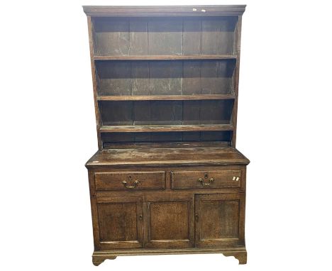 Georgian oak dresser with shelved back over a base with two drawers and two panelled doors raised on bracket feet, 118cm wide