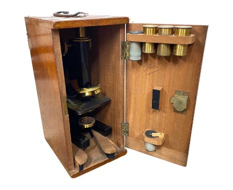 R &amp; J Beck Ltd, London, a brass and black lacquered adjustable monocular microscope numbered 29685 together with accompan