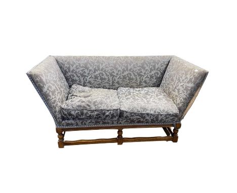 Antique style blue upholstered sofa with loose cushions