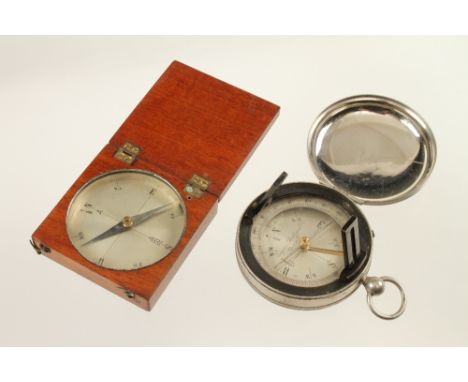 A steel cased prismatic compass with folding sights and a wood cased compass (Jay Gaynor collection) G