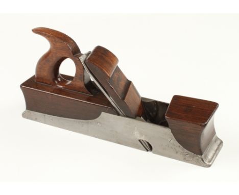 A fine quality skew mouth iron panel plane 14" x 3" with shaped toe and heel and rosewood infill, handle and scrolled wedge h