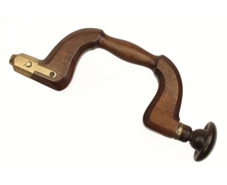 An early brass button pad beech brace by I SYM (mark G+ on shoulder) with rosewood head (illustrated Russell fig 1429) G+ 