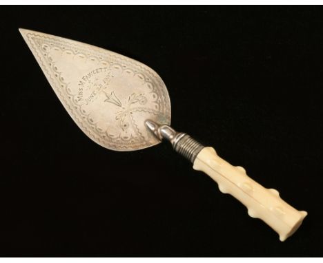 A small silver plated presentation trowel with Miss Fawsett June 28 1887 with decorative surround, hair crack to carved ivory