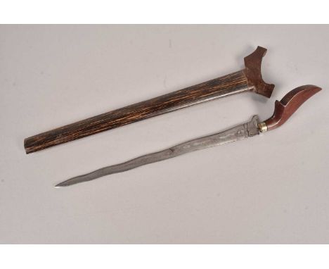 A Middle Eastern Kris, having wavy double edged blade, 32.5cm, with shaped wooden handle and zebra wood scabbard, overall 51c