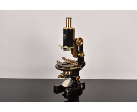 A Mid 20th Century black lacquered and brass Carl Zeiss 'Jug-Handle' Monocular Microscope, serial 41567, having triple nose p