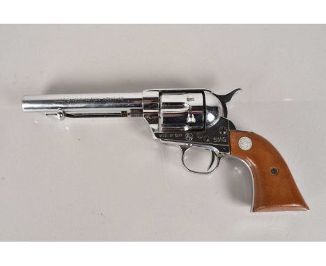 A Colt Single Action Army .45 Blank Firing revolver by SMG, Model 10.77, in chrome with wooden grip, this lot is offered for 