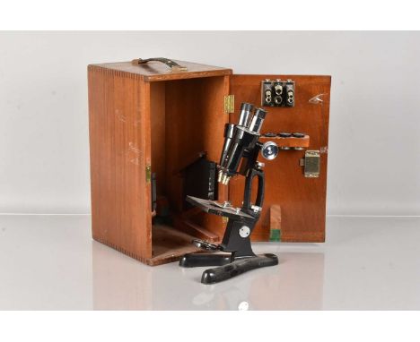 A Beck of London Binocular Microscope, having 'Jug Handle' frame, with wishbone stand, serial 9798, with three sets eye piece