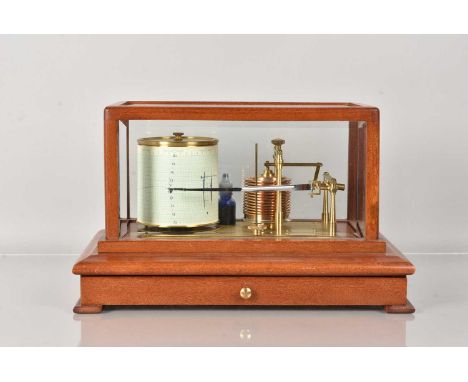 A modern cased Barograph, unnamed, the glazed case having glass panels all round, with lower pull out drawer to the base, wit