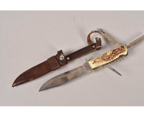 A German Hunting knife by Decora of Solingen, the 13cm long blade marked D.B.G.M, multi-tools within the grip, complete with 