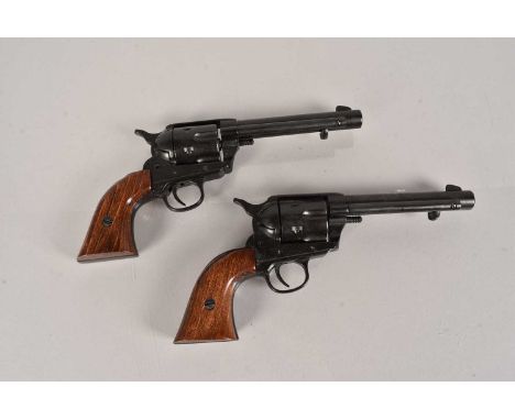 A pair of Single Action Army .45 Blank Firing Revolvers, in black with wooden grips,  this lot is offered for the purposes of