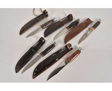 A collection of five Hunting knives, comprising William Rodgers, and Wright & Sons, all with scabbards, majority with handwri