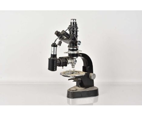 A large complex Ernst Leitz GmbH Wetzlar Microscope, serial 534392, with monocular and binocular eye pieces, rotating stage, 