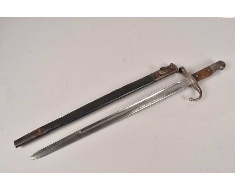 A Turkish 1890 Pattern Ottoman period bayonet and a scabbard, having marks to the base of the 46cm long single fullered blade