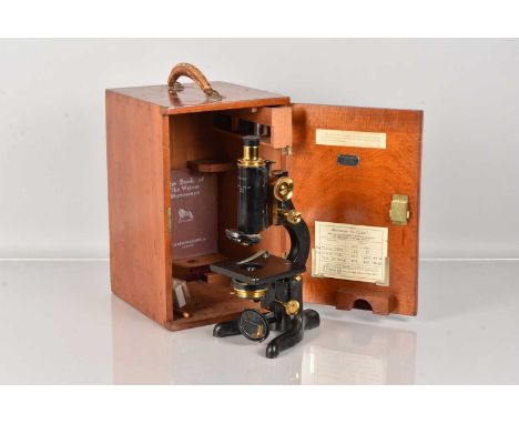 An Antique Brass Monocular Microscope, unnamed, having single eyepiece and objective, complete with glass slide and a small B
