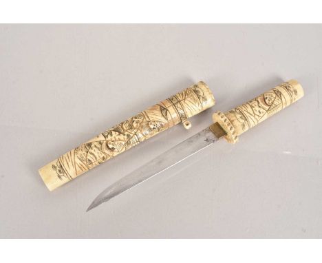 An Chinese Bone Tanta, having figural carved decoration to the bone grip and scabbard, with 15cm long single edged blade, no 