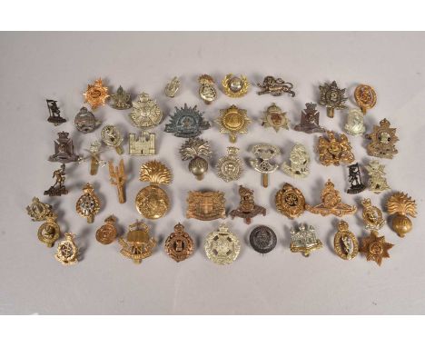 A collection of British Cap badges, to include Army Catering Corps, The Cambridgeshire Regiment, Army Educational Corps, 5th 