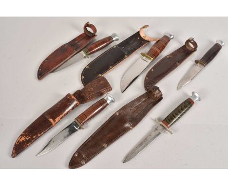 A group of five hunting knives, all similar in design, by different makers, including Wright & Son, William Rodgers, and anot