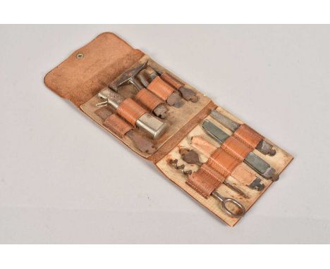 A War Period German Multi-Tool Kit, (BONSA), marked DRGM, comprising can opener, hammer, corkscrew, saw, file, and more, all 
