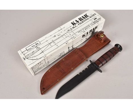 A KA-BAR U.S.M.C Fighting Knife, with serrated edge, complete with scabbard, retailers box and manual, no postage for this lo