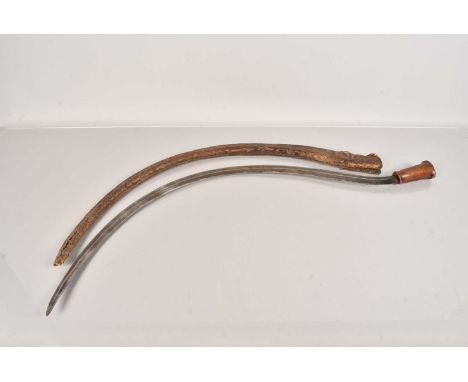 A Middle Eastern Sickle, having 94cm long double edged curved blade, with horn handle, complete with scabbard scabbard AF, th