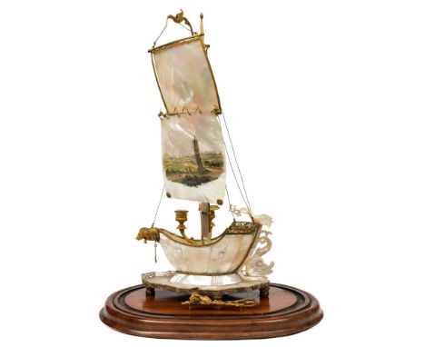 A Regency design Continental mother of pearl and gilt brass twin branch candelabrum in the form of a galleon:, the mother of 