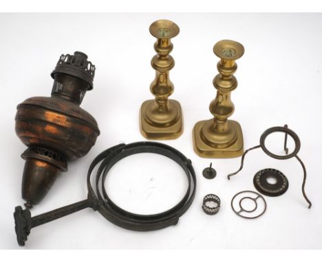 An early 20th century copper and iron gimbaled cabin oil lamp:, together with a pair of brass candlesticks.