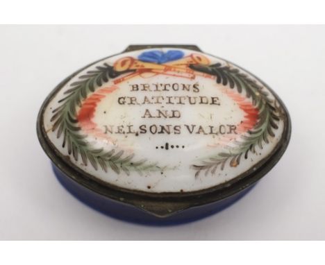 An early 19th century  oval patch box 'Britons Gratitude and Nelsons Valor':, white enamel cover with polychrome text and cob