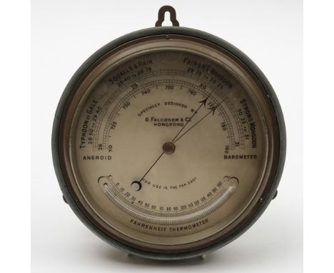 A bulkhead aneroid barometer designed by  G Falconer & Co, Hong Kong:, the 7 1/2 inch dial signed as per title and inscribed 