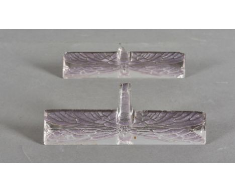 A pair of R Lalique dragonfly Libellule knife rests, stained amethyst, signed to side R Lalique France, af to tails, 9.5 cm