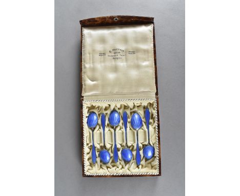 A set of six silver and enamel Scandinavian spoons, the blue guilloche enamel handles and spoon backs with silver gilt bowls 