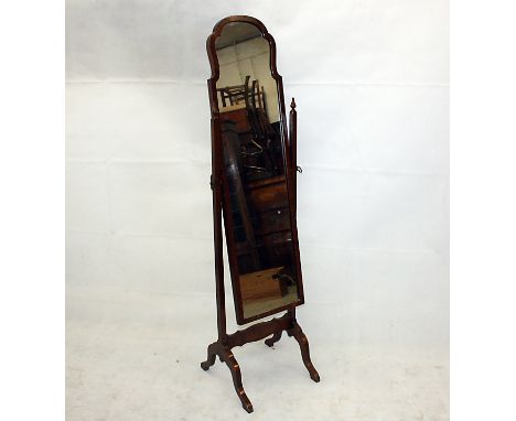 A Windsor and Neate of Newbury walnut cheval mirror, with shaped top supported on arched bracket feet, 43 cm wide x 161 cm hi