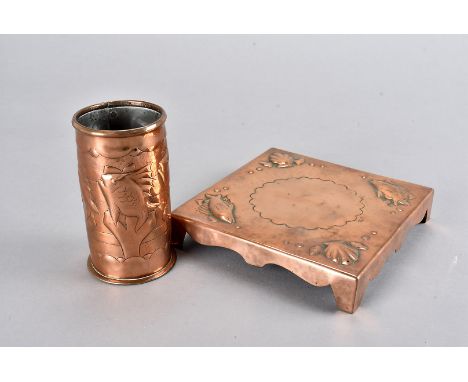 A Newlyn copper arts and crafts teapot stand, of square shape with embossed corners of shells and fish, stamped to side of br