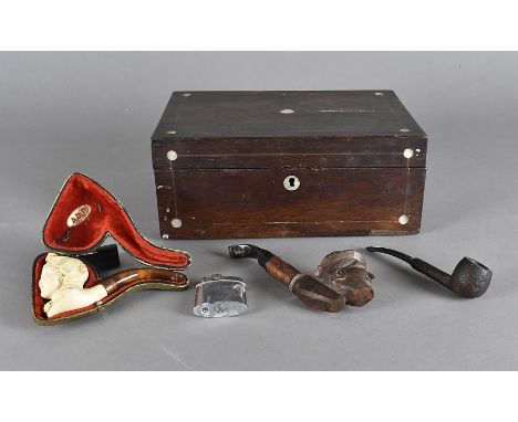 A carved meerschaum and amber pipe, the bowl modelled as female face in fitted case, a black forest example with tyrolean gen
