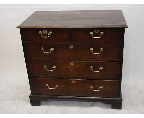 A country oak chest of drawers, two short over three long drawers on bracket feet, 96 cm wide x 87 cm high x 53.5 cm deep
